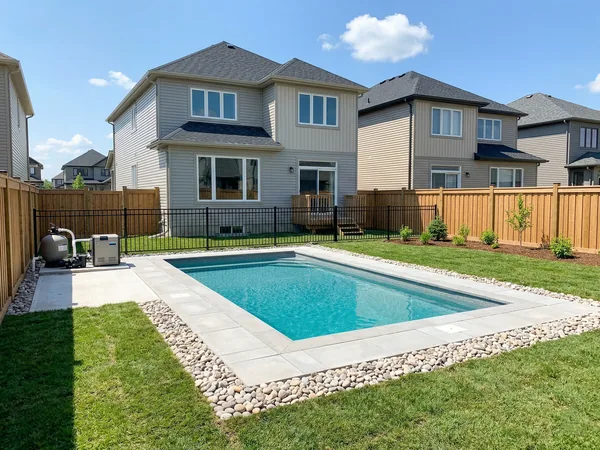 Brand new inground pool in a recently built Binbrook subdivision with fresh landscaping